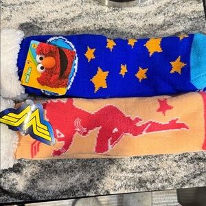 NWT Sherpa Sesame Street Blue Elmo and orange Wonder Woman sock/slippers.
